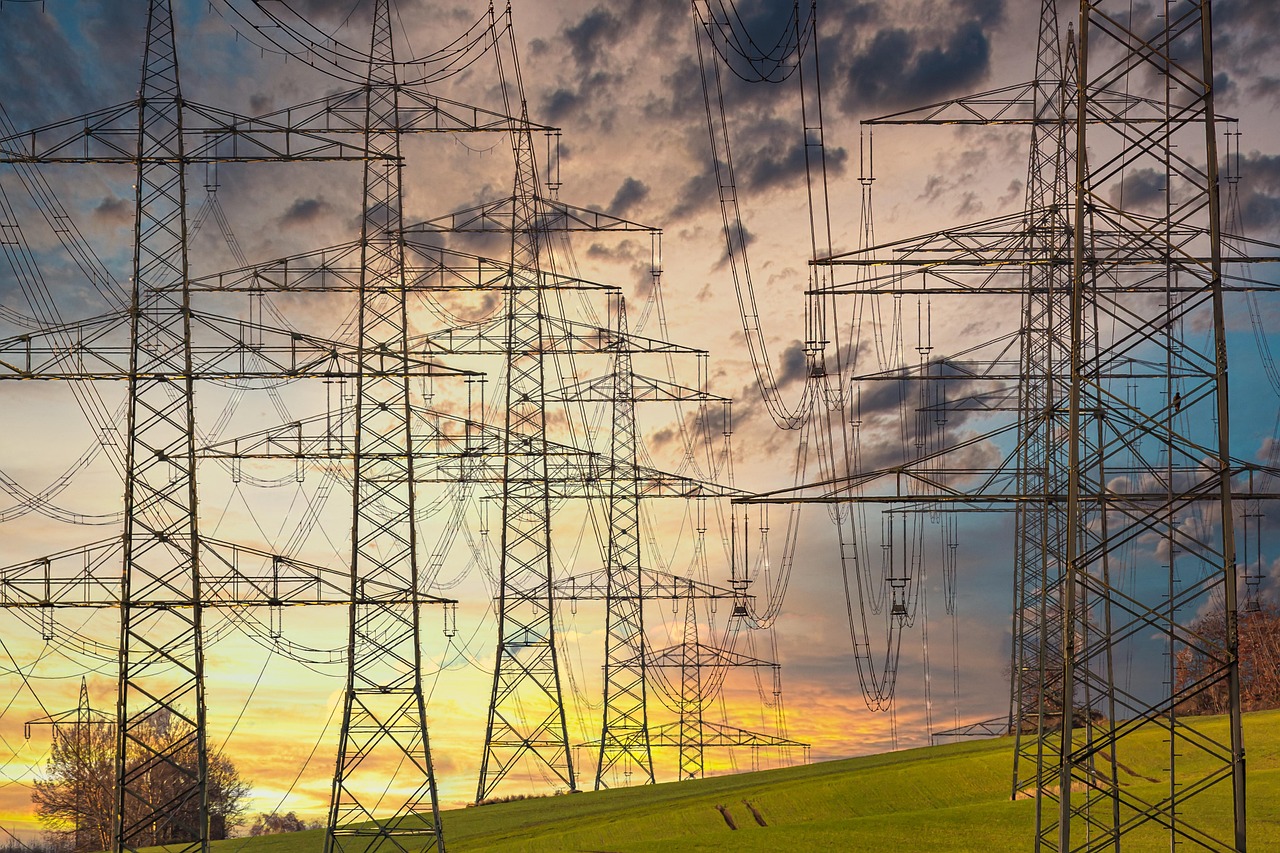 electricity electricity pylons nature power lines high voltage pylons high voltage high voltage line electric cable industry energy technology electrics sunset multicoloured clouds power line orange yellow blue