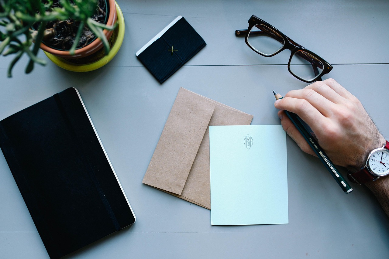 hand man watch work desk workspace people business male person businessman letter envelope pen writing notebooks business business letter letter letter letter letter envelope writing