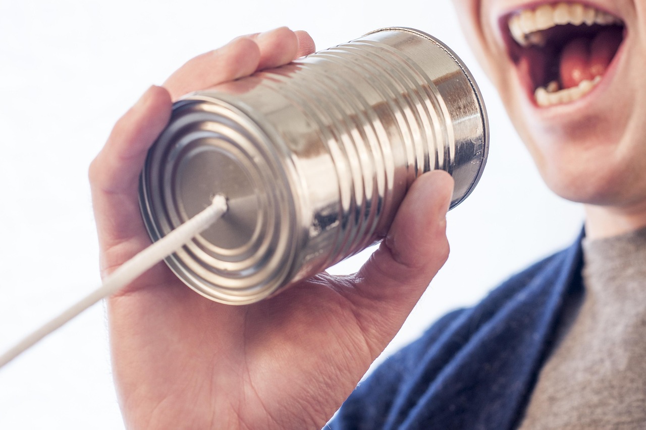 tin can speak talk microphone can tin mouth say communicate string yell hand teeth man guy speak speak speak talk talk talk talk talk microphone microphone mouth say communicate communicate